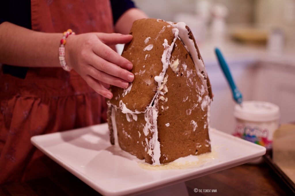 Baketivity Gingerbread House Building Kit being constructed by a child.