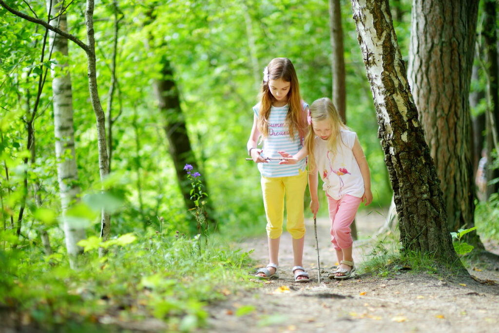 Two girls on a nature study - Charlotte Mason style homeschooling