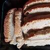 Homeschool Resource Co. Sliced homemade bread with a golden crust, perfect for homeschooling snack time or breakfast. Freshly baked, soft interior, ideal for family meals and educational activities.