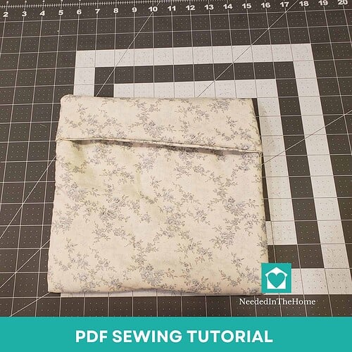 Step-by-step PDF sewing tutorial for homeschool projects, featuring fabric with delicate floral pattern, perfect for beginner and advanced sewists.