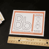 Letter B phonics flashcard for early reading skills. Educational letter B flashcard for preschoolers with phonics sounds, featuring a ball, bear, and cake to help children learn letter sounds and improve early literacy.