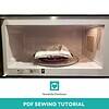 Microwave oven with fabric and sewing project inside, demonstrating a creative homeschooling activity for DIY crafts and sewing lessons.