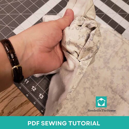 Homeschool Resource Co. Sewing Tutorial Hand sewing fabric with a knot for DIY projects, demonstrating basic sewing techniques for homeschool crafts.
