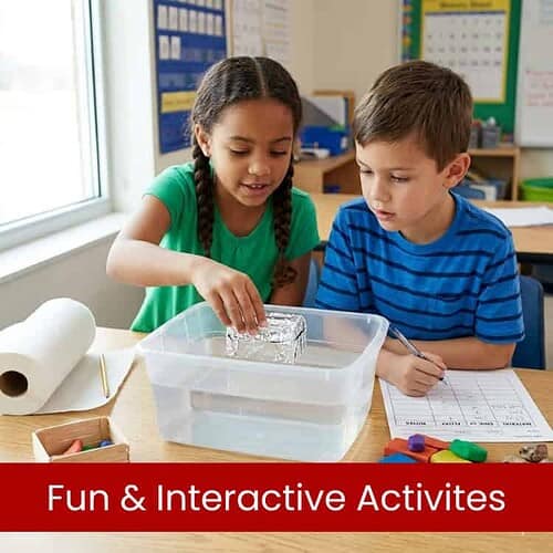 Two children conducting a science experiment with a clear water tank in a classroom setting.