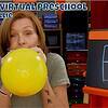 A colorful preschool classroom with a woman holding a yellow balloon, surrounded by educational materials and storage bins, promoting creative kids virtual preschool activities.