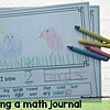 Preschool homeschool math Child's colorful drawing of a bird and a duck on a math journal page with crayons nearby.