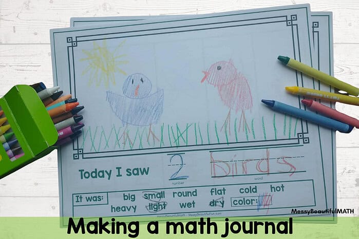 Preschool homeschool math Child's colorful drawing of a bird and a duck on a math journal page with crayons nearby.