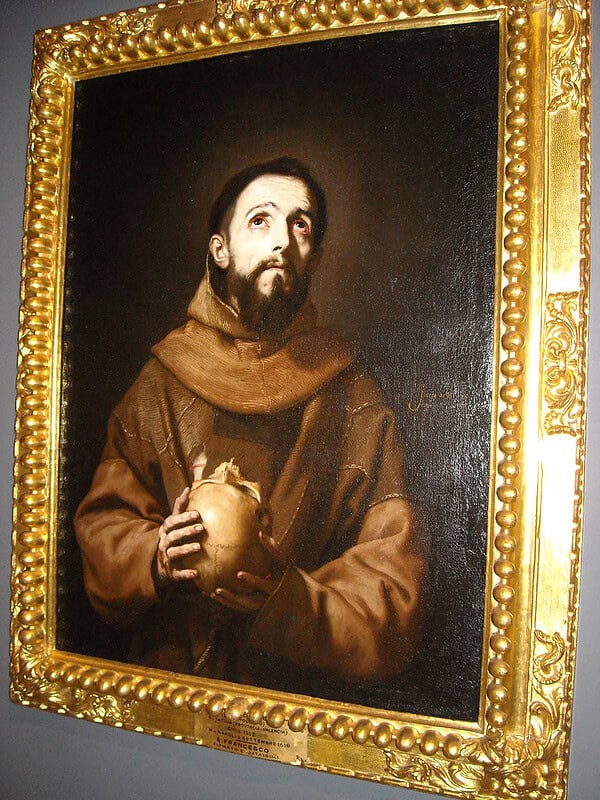 Religious Artwork of Saint with Sacred Heart Saint holding a sacred heart in a gold ornate frame.