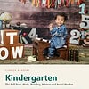 clareza-kindergarten.jpg Young child in a denim outfit sitting at a wooden desk with educational toys and numbers, celebrating kindergarten learning at home.