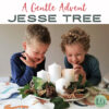 3 Two young boys smiling and looking at a festive Advent centerpiece with candles and pinecones.