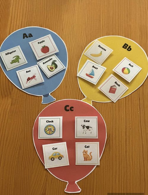 Letter Balloons Preview Educational alphabet balloon flashcards for homeschooling with images of animals, fruits, and objects.