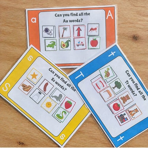 Educational card game for children with colorful images and questions about finding words with specific letters.