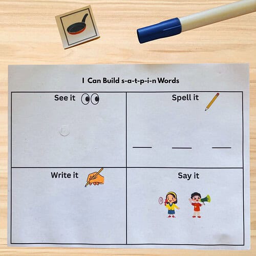 Educational worksheet for building s-a-t-a-p-i-n words with illustrations and writing sections.