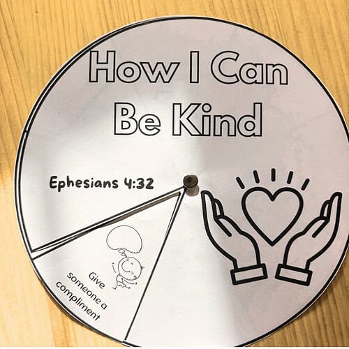 Decorative clock with the phrase 'How I Can Be Kind' and a Bible verse Ephesians 4:32, featuring a heart and hands illustration, promoting kindness and compassion.
