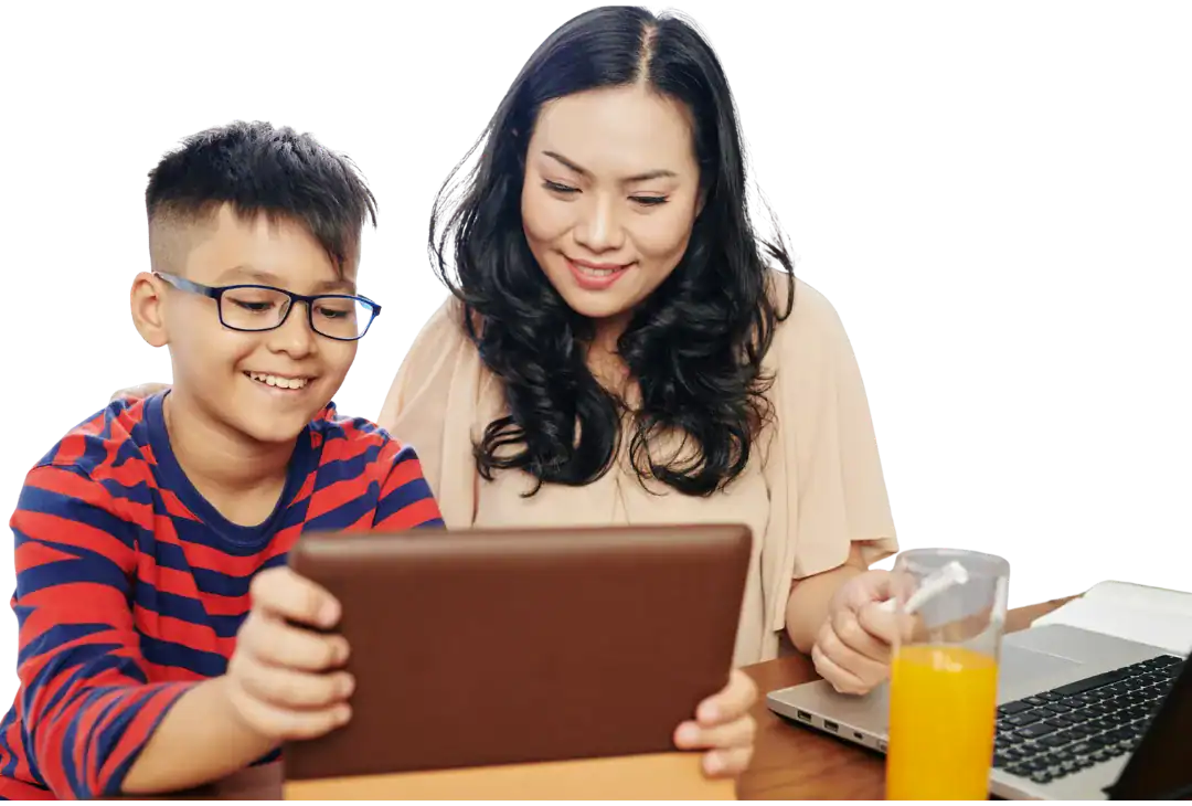 Young boy and woman using a tablet together for homeschooling activities.