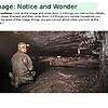 original-12612681-1.jpg A person exploring a dark, underground tunnel with rough, rocky walls and a low ceiling, illuminated by a faint light.