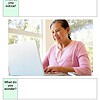 original-12684228-1.jpg Smiling woman using a laptop at home, engaging in homeschooling activities with sunlight streaming through the window.